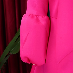 Detailed close-up of vibrant magenta lantern sleeves with premium elastic cuffs
