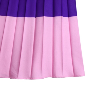 Close-up of pleated skirt detail featuring purple and pink color contrast design