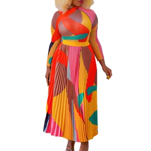 Detail of colorful geometric print pleated dress with slim waist and long sleeves