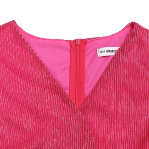 Detail of pink metallic V-neck dress with glitter texture and back zipper
