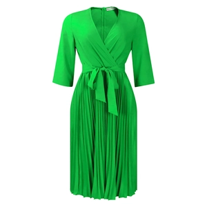 Detail of elegant green V-neck pleated midi dress with matching waist belt and long sleeves