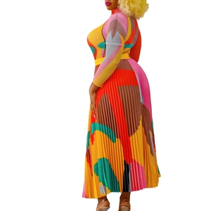 Detail of colorful geometric pleated dress showing fine pleats and waist belt textures