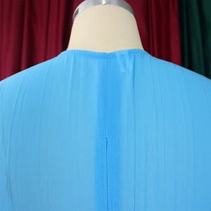 Detail of sky blue pleated chiffon fabric texture on a fashion top back view