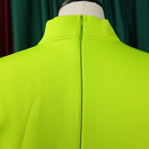Detail of lime green evening gown showing back stand collar and hidden zipper closure