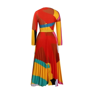Detail of colorful abstract geometric print on long sleeve pleated maxi dress