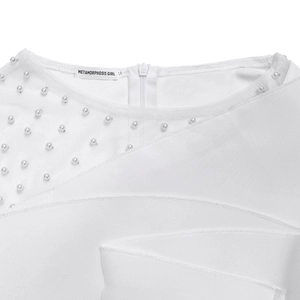 Detail of white mesh patchwork neckline with beaded pearls and invisible zipper