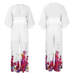 Detail of V-neck lantern sleeve top and wide-leg trousers with floral print at hem