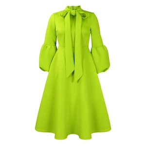Detail of neon green lantern sleeves and bow neckline on a plus size evening dress