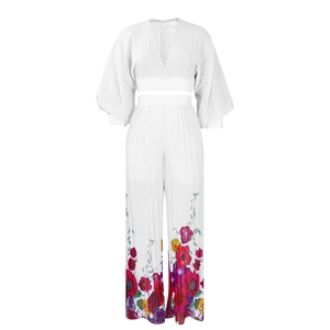 Detail of white V-neck chiffon top and wide-leg pants with large floral prints