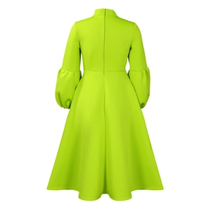Detail of neon green formal dress featuring a puff sleeve design and back hidden zipper