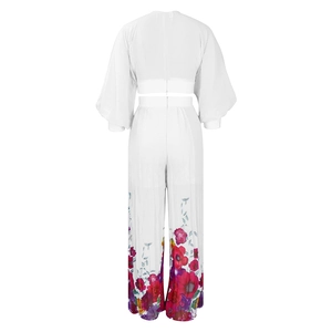 Detail showing flared sleeve top and high-waisted wide-leg trousers with floral print