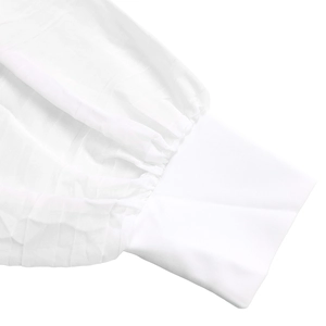 Detail of elegant pleated chiffon sleeve and sleek white cuff on a stylish blouse