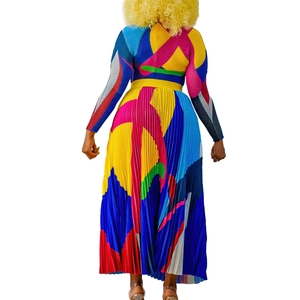 Back view showing geometric pleated texture and multi-color patchwork of the maxi skirt