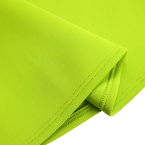Detail view of lime green fabric showing professional double-stitching and high-quality texture