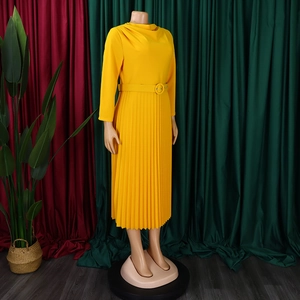 Detail of yellow pleated midi dress featuring a turtleneck and matching belted waist