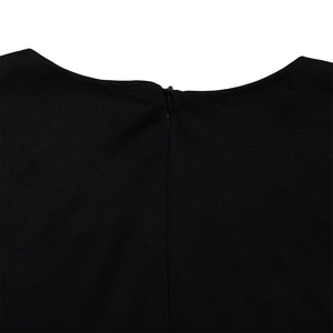 Close-up of elegant round neckline and concealed back zipper on a black evening jumpsuit