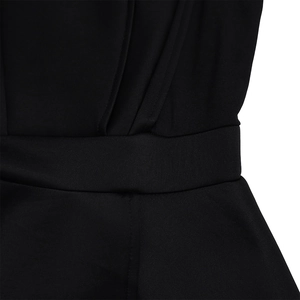Detailed view of the pleated waistline on a black mesh patchwork wide-leg jumpsuit