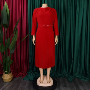 Detail of red pleated midi dress featuring long sleeves and a matching buckle belt for waist