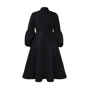 Back view of black puff sleeve A-line dress with high waist and hidden zipper closure