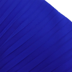 Close-up of royal blue pleated fabric texture showing detailed accordion fold patterns