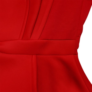 Close-up of red jumpsuit waistline with mesh stitching and neat vertical pleated details