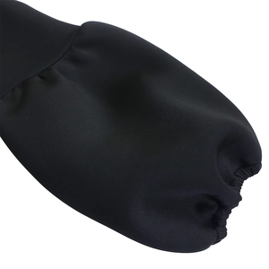 Detail of puffed sleeve cuff with elastic smocked wrist on a black evening gown