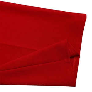 Close-up of the bright red mesh jumpsuit showing fine fabric texture and neat stitching