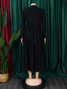 Back view of elegant black maxi dress featuring beaded shoulders and a waist bow tie