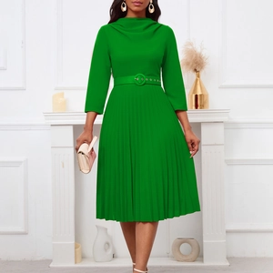 Detail of the bright green pleated midi dress with a high collar and matching belt buckle