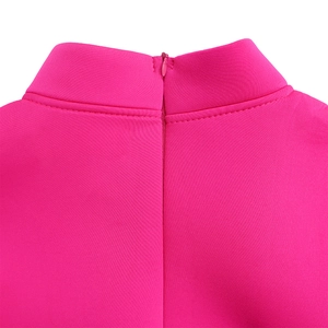 Macro shot of rose pink high neck dress showing neat stitching and hidden zipper closure
