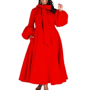 Detail of red lantern sleeves and oversized bow neckline on an elegant maxi dress