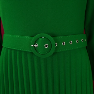 Detail of emerald green pleated dress featuring a fabric-covered belt with silver eyelets