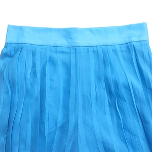 Detailed close-up of vibrant royal blue pleated chiffon wide-leg trousers waist design