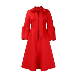 Detail of red lantern sleeves and elegant bow tie neckline on the high waist dress
