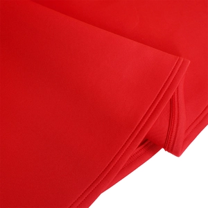 Close-up of red puff sleeve dress fabric showing high-quality double-stitch sewing detail