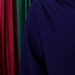 Detail of dark blue pleated fabric with high density texture and elegant matte finish