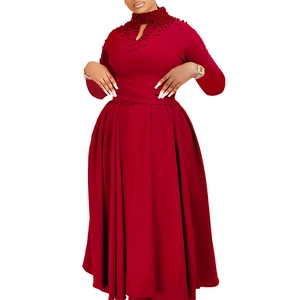 Detail of high neck wine red dress featuring intricate beadwork and elegant pleats