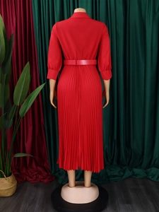 Back view of elegant red pleated long sleeve dress with waist belt and shirt collar detail