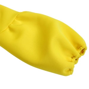 Detailed view of puff balloon sleeve with elasticated cuff on bright yellow dress