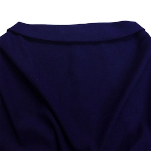 Detail of the high-quality navy blue wool lapel and neckline stitching on a stylish dress