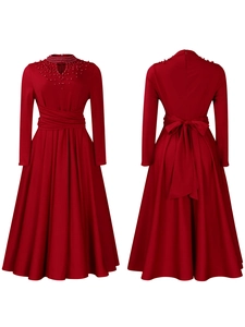 Detail of red high-neck dress featuring pearl embellishments and a back bow tie knot