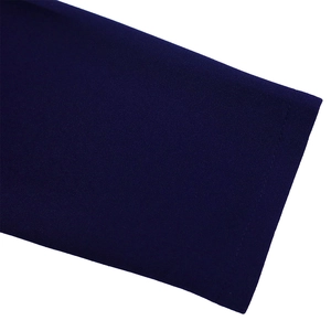 Detailed close-up of navy blue dress hem with professional single-needle stitching finish
