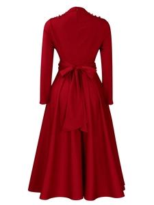 Detail of burgundy long sleeve A-line dress with waist bow and pearl shoulder accents