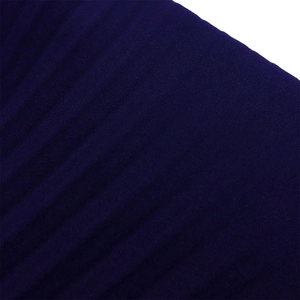 Detailed macro view of dark purple pleated fabric texture with elegant vertical folds