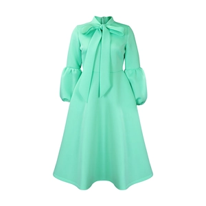 Detail of mint green dress with large bow-tie neckline and puff lantern sleeves
