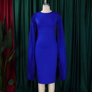 Detailed view of the dark blue pleated cape sleeve on a form-fitting party dress