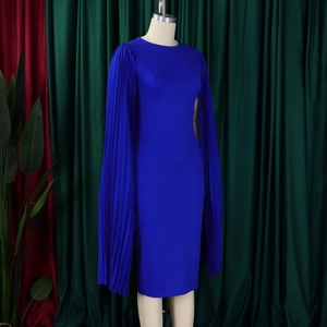 Detail of royal blue party dress featuring pleated cape sleeves and smooth fabric texture