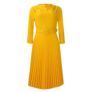 Detail of elegant pleated yellow dress showing draped neckline and fabric texture