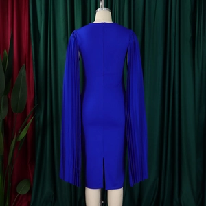 Detail of the royal blue evening dress showing pleated cape sleeves and back slit design
