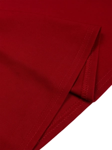 Close-up of high-quality double-needle stitching and overlock hem on red knit dress